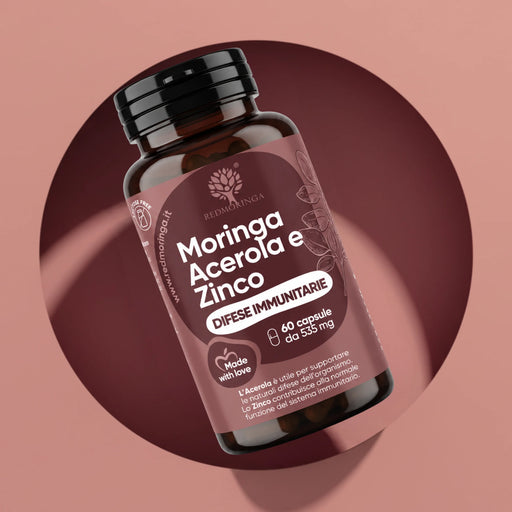 Flacone Moringa Acerola e Zinco RedMoringa, integratore difese immunitarie, 60 capsule da 535 mg su fondo rosa