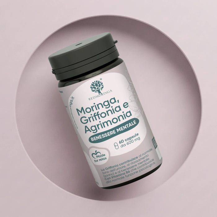 Vista ravvicinata del flacone RedMoringa "Moringa, Griffonia e Agrimonia - Benessere Mentale". Confezione da 60 capsule da 600 mg con etichetta multilingua.